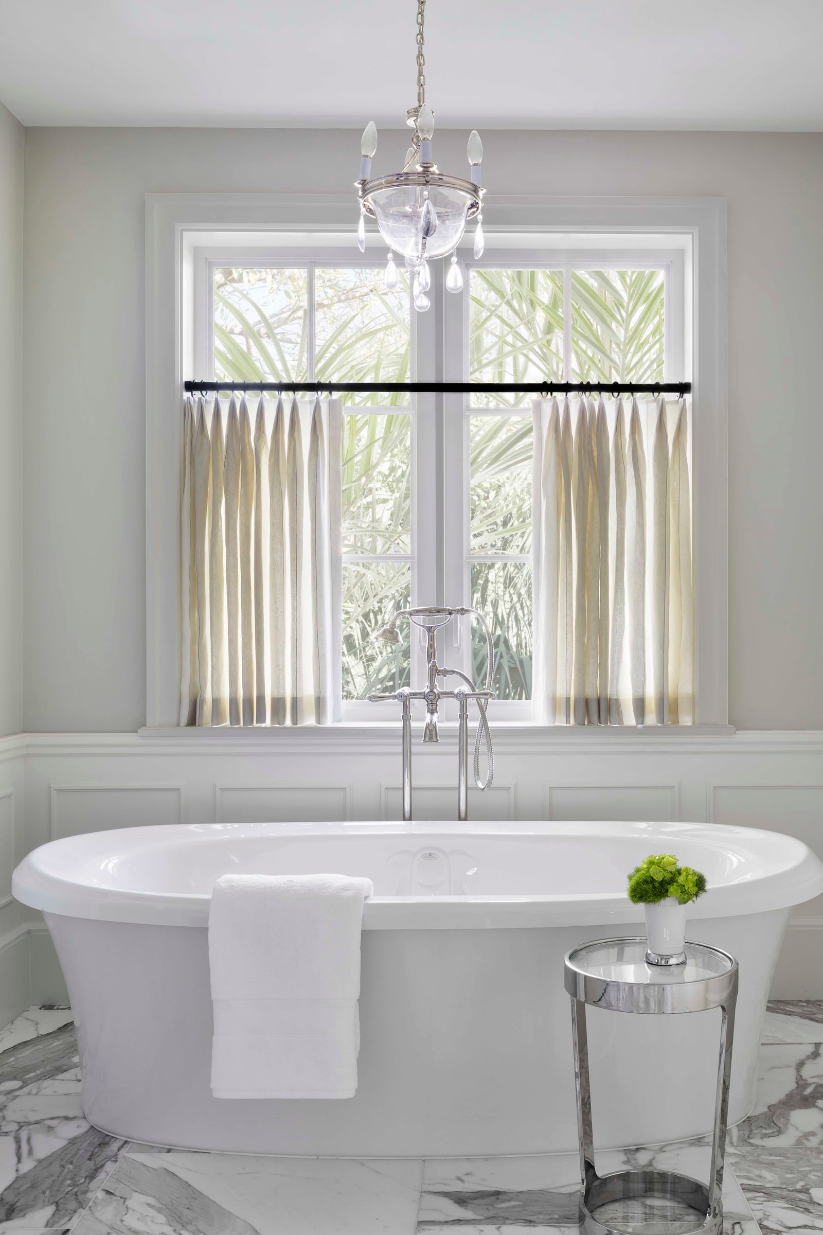 Bath under a chandelier