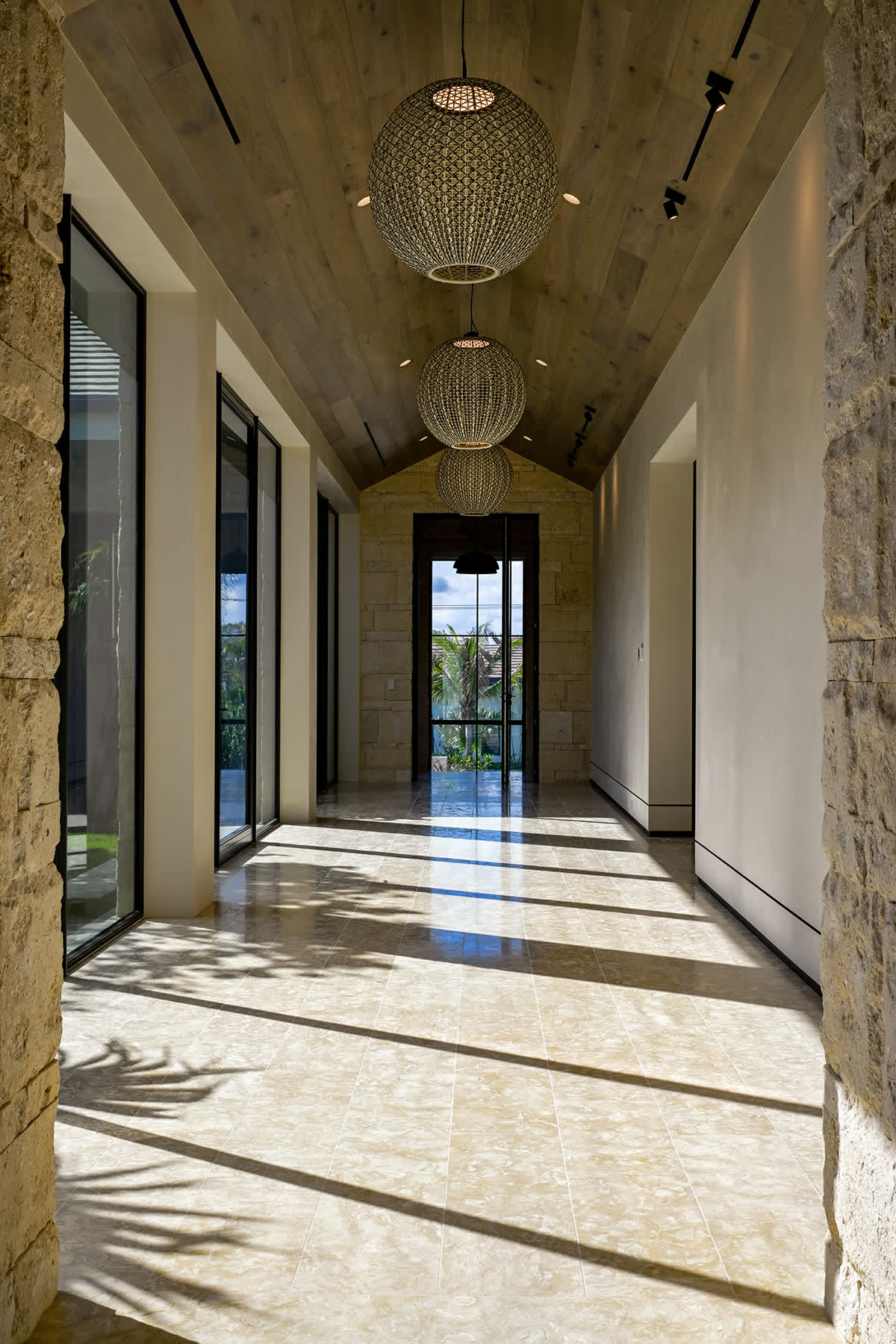 Entry hall in stone and glass